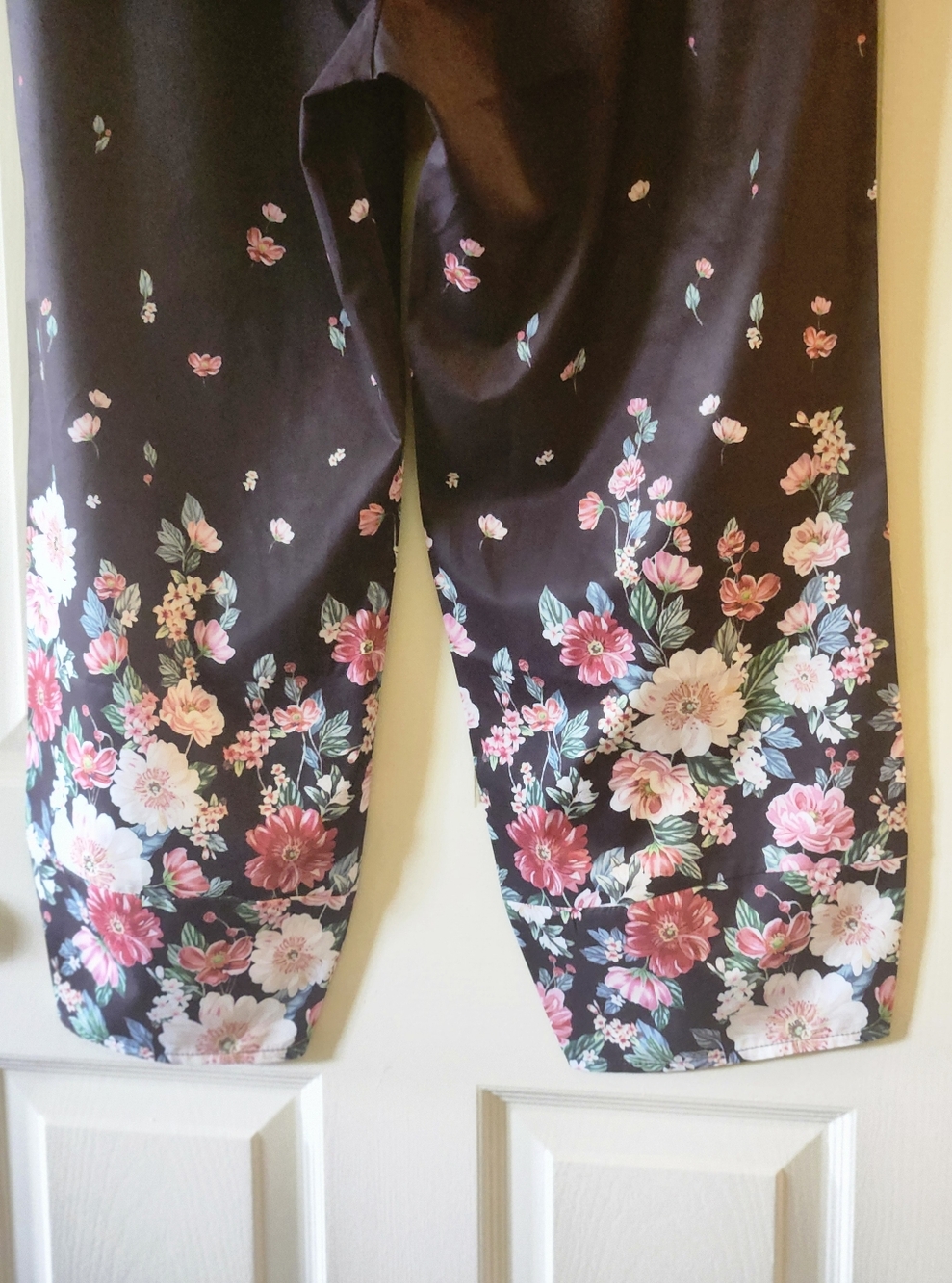 Wide Leg Floral Pants in Black with Pink Floral Print.  Legs have a rounded